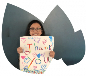 child holding thank you sign